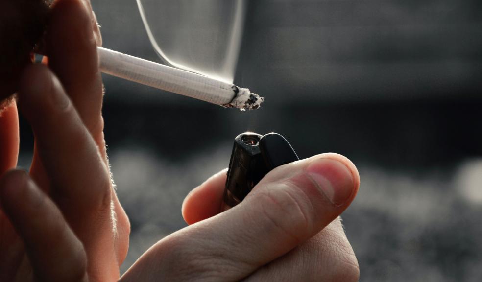 A Close-Up Shot of a Person Smoking a Cigarette A Close-Up Shot of a Person Smoking a Cigarette