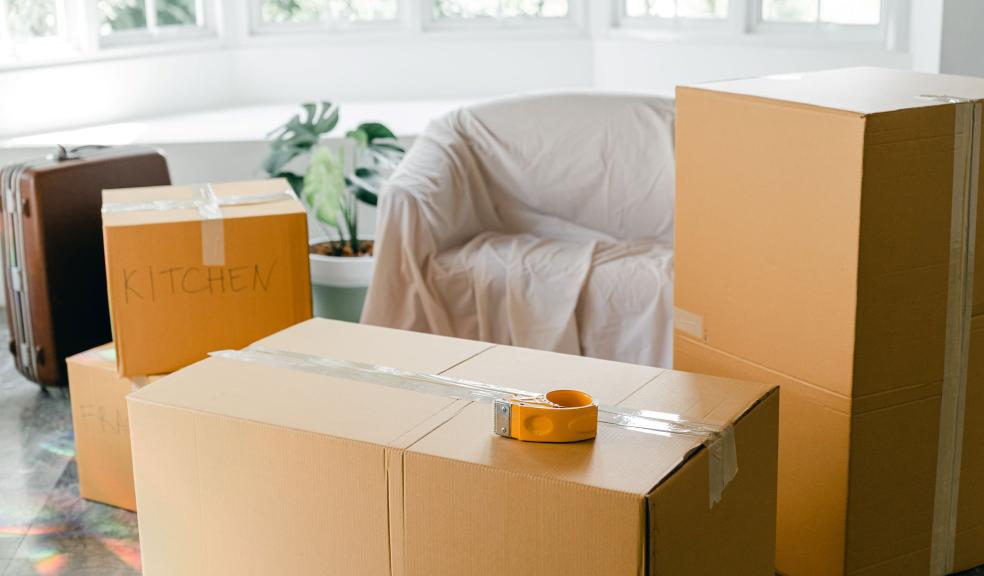 Empty apartment with packed carton boxes before moving