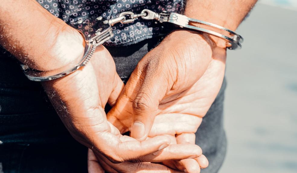 Close Up Photography of Person in Handcuffs