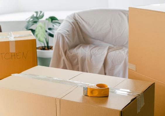 Empty apartment with packed carton boxes before moving