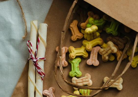 dog biscuits and munchie bones in a brown paper bag