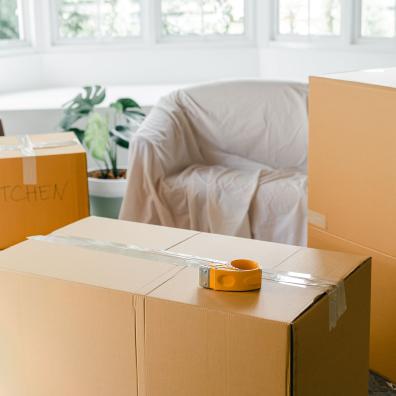 Empty apartment with packed carton boxes before moving