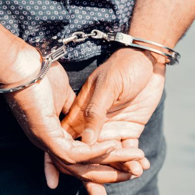 Close Up Photography of Person in Handcuffs